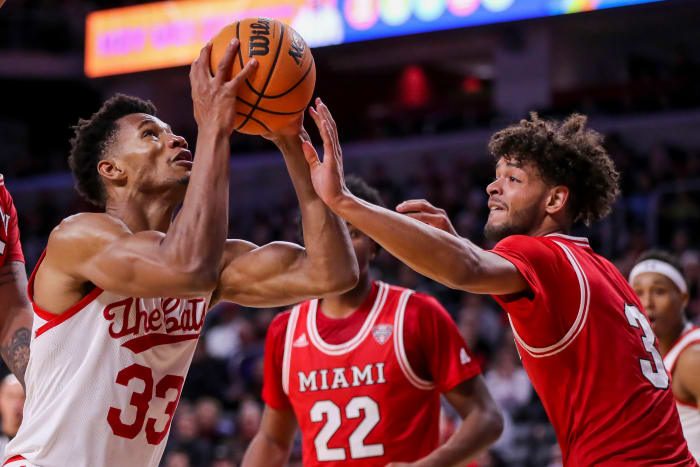 Dec 14, 2022; Cincinnati, Ohio, USA; Cincinnati Bearcats forward Ody Oguama (33) drives to the basket against Miami Redhawks guard Julian Lewis (3) in the first half at Fifth Third Arena. Mandatory Credit: Katie Stratman-USA TODAY Sports
